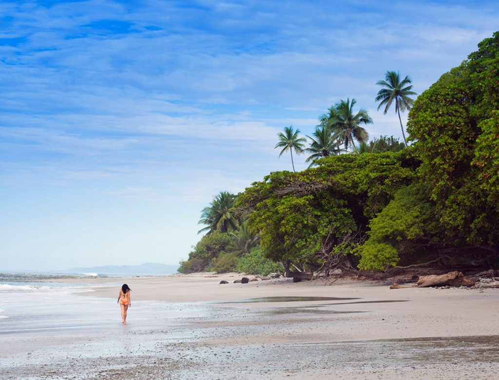 Family enjoying a quiet beach moment in Santa Teresa during low season.