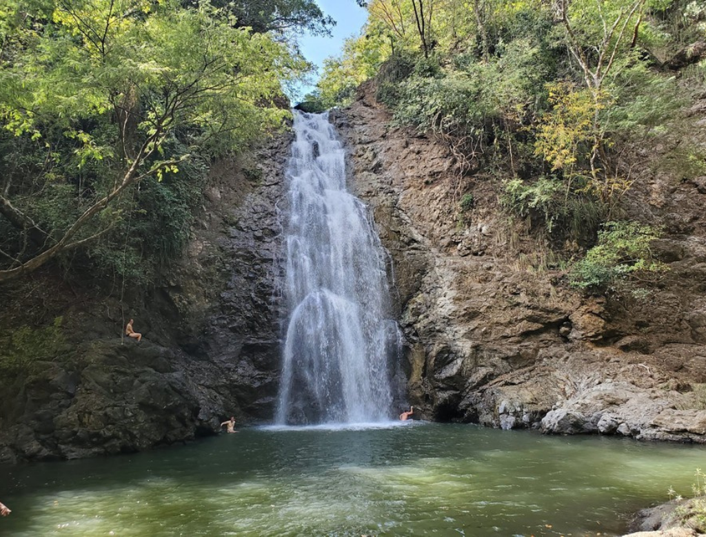 Santa Teresa waterfall surrounded by tropical forest in Costa Rica